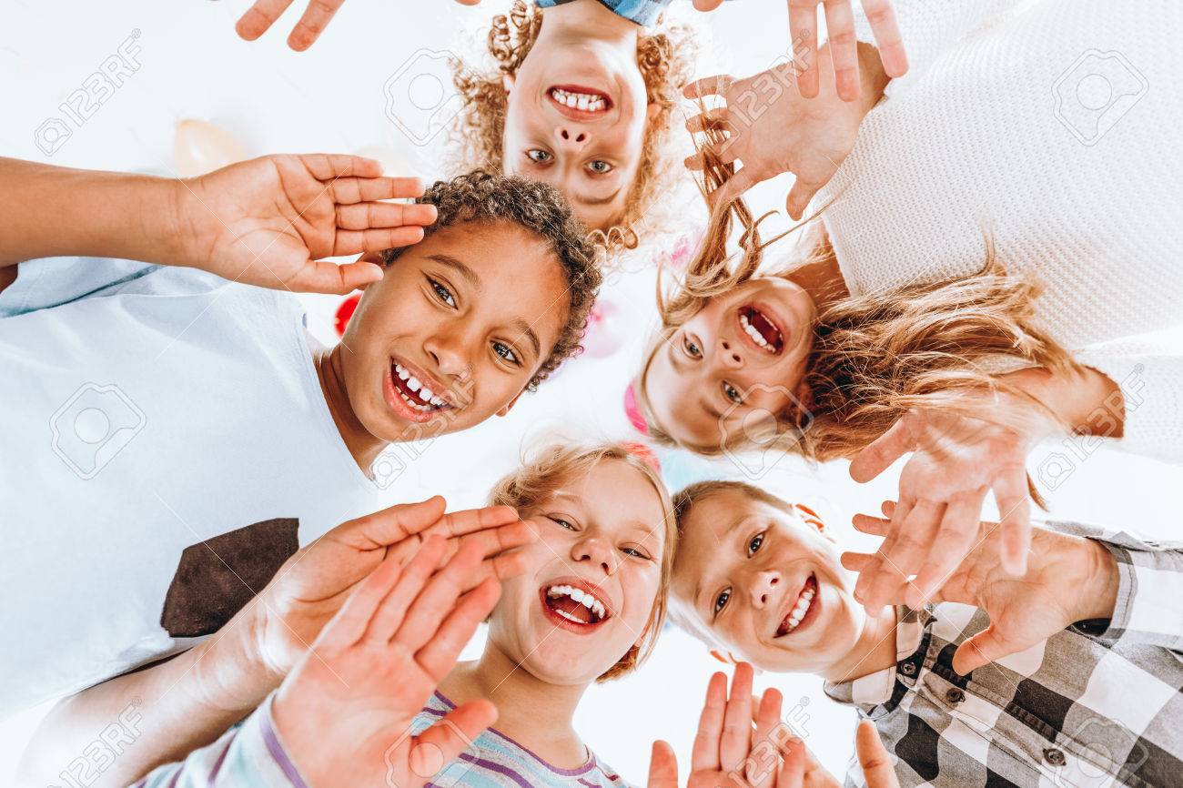 Happy children waving